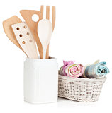 Kitchen utensils in holder and towels