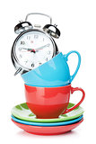Coffee cups and alarm clock