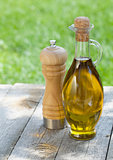 Olive oil bottle and pepper shaker