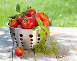 Fresh ripe tomatoes in colander