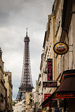 Parisian Street against Eiffel Tower in Paris, France