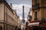 Parisian Street against Eiffel Tower in Paris, France