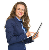 Smiling business woman using tablet pc