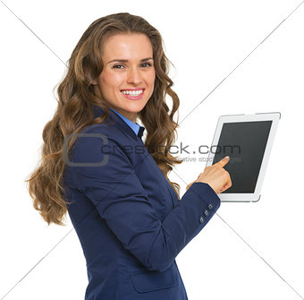 Portrait of smiling business woman using tablet pc