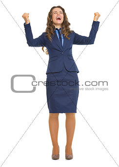 Full length portrait of happy business woman rejoicing success