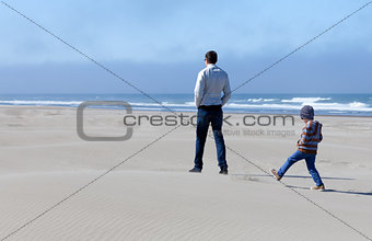 family in sand dunes