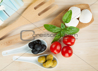 Mozzarella, olives, tomatoes and basil