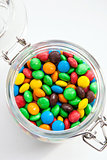 Colored candy in a glass jar