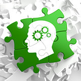 Psychological Concept on Green Puzzle Pieces.