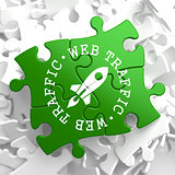 Web Traffic Concept on Green Puzzle Pieces.