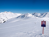 A sign in the Austrian alps wich says danger of avalanches