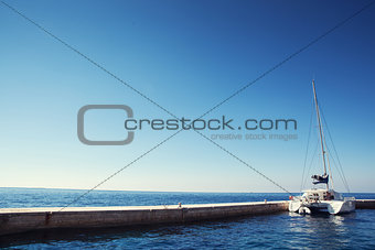 sea and catamaran in dock