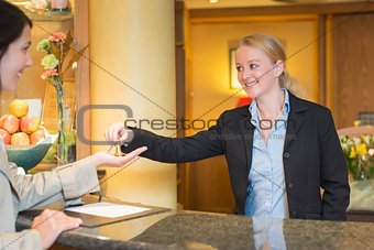 Smiling friendly hotel receptionist