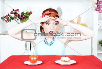 Screaming woman choosing between tomato and cake