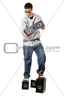 Young man with a four speakers. Isolated 