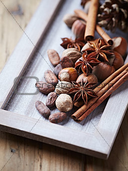 Spices, nuts and cocoa beans for christmas baking
