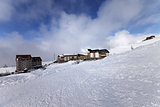 Houses and hotels on ski resort, view from ski slope