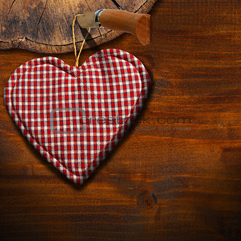 Cloth Heart on Brown Wood Background