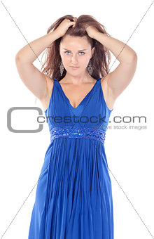 Portrait of a beautiful young woman in blue dress, holding on to