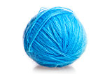 blue ball of woolen threads on a white background