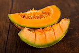 Yellow melon on wooden table