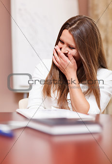 Businesswoman laughing in a meeting