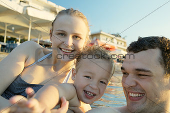Happy young family at the seaside