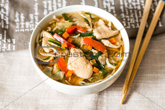 Bowls of Asian soup noodles and vegetables 