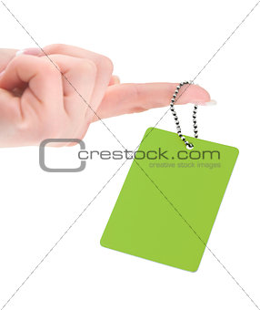 female hand holding empty price tag