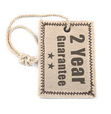 Two year guarantee tag over white 