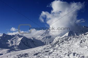 Snowdrift, ski slope and beautiful snowy mountains