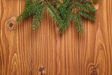 green spruce twig on wooden plank