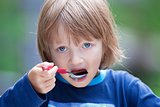 Portrait of a Boy Eating