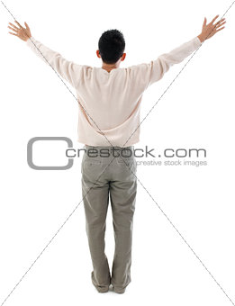 Rear view Asian man arms outstretched