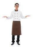 Happy Asian chef welcoming pose