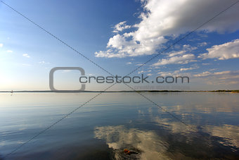 River and clouds with reflection in water