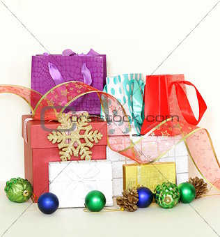 many gift boxes and colorful shopping bags on white background