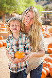 Attractive Mother and Son Portrait at the Pumpkin Patch 