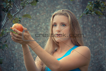 Eve in Paradise, taking the apple