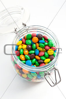 Colored candy in a glass jar