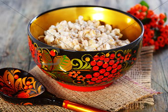 Pearl barley porridge in a colorful bowl.