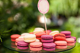 Tasty colorful macaroons on plate