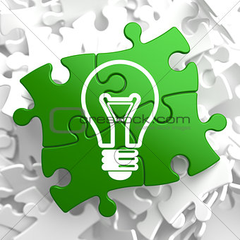 Light Bulb Icon on Green Puzzle.