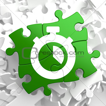 Stopwatch Icon on Green Puzzle.