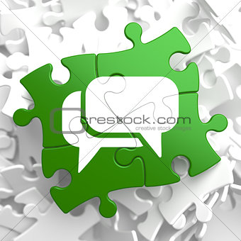 White Speech Bubble Icon on Green Puzzle.