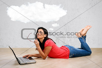 Young woman smiling in front of laptop