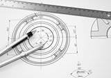 Compass and ruler lie on the drawing