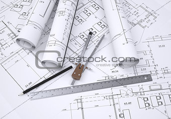 Compass, pencil and ruler lie on the drawing