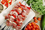 Shashlik - pieces of raw meat on the skewers.