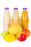 Fresh bottles of juice with fruits isolated on white 